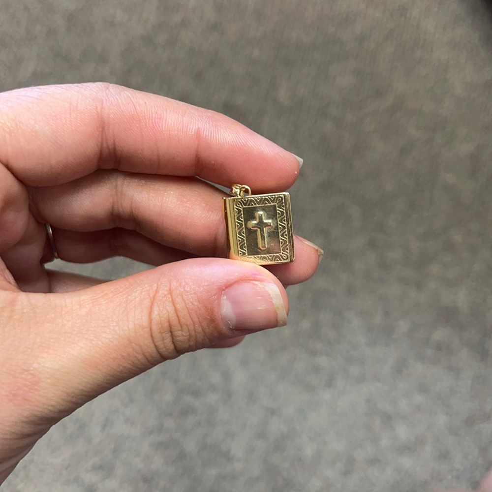 This is a 10k gold made in Israel locket. It is a Bible with gospel book Names